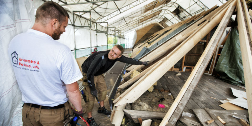 Picture of builders working on a roof.