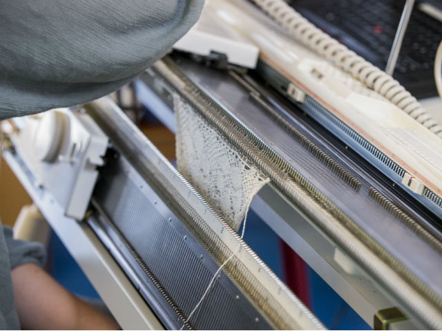 Student working with weaving at VIA Design