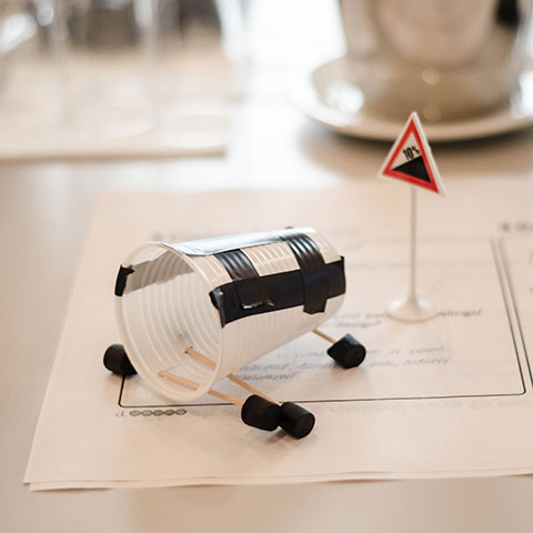 Plastic cup with tape on a table.