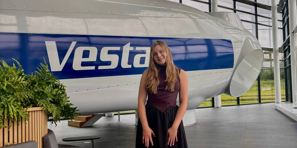 Paloma Krastina, Global Business Engineering graduatein front of a windturbine at her work place Vestas